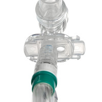 The sliding valve isolates the catheter and prevents fluid from entering the trachea.